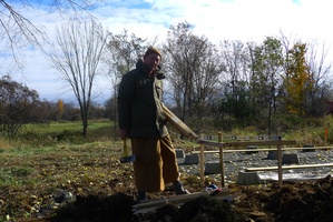 Ven. Khemako works on the foundations of the new kuti