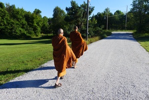 Ajahn Dtum and Ven. Cunda head out for alms