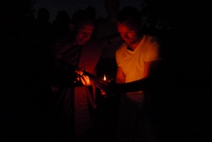 Tan Suvijjano and Darryl light incense in preparation for the circumambulation on Asalha Puja