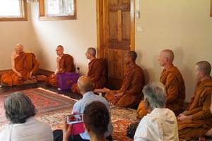 Monastics and laity assembled to greet Luang Por Liem on his arrival