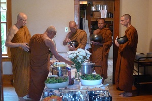 Bhikkhus collect almsfood