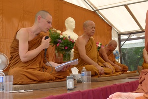Ajahn Thaniyo reads a translation of Luang Por Liem's talk on the day of the ceremony for the upcoming meditation hall