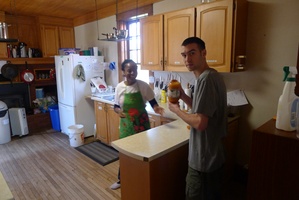 Beatrice and Tyler at work in the kitchen