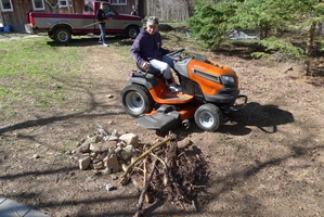 Alex gets ready to cleanup the newly cleared area near the house