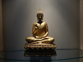A Thai-style Buddha image with hands in the teaching posture.  Displayed in the Bhikkhu Vihara