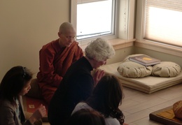 Tina ceremonially offers the keys to the Bhikkhu Vihara to the Sangha