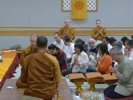 Ambassador Pisan dedicates cloth offerings to the Sangha