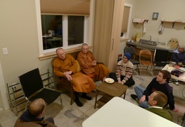 Senior monks chat wiht laity in the new bowl room