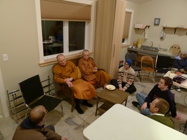 Senior monks chat wiht laity in the new bowl room