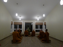 Bhikkhus sit formally during the kathina ceremony