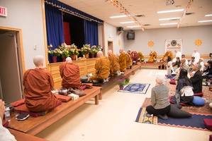Monastics pay homage to the three jewels to open the ceremony