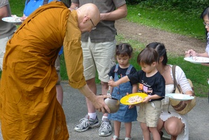 Luang Por Viradhammo receives alms