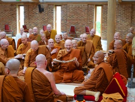 Luang Por Sumedho offering robes to the other monks