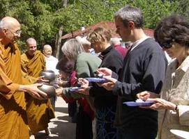 Monastics go on a rice pindapat for Vesak