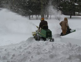 A team gets to work clearing snow.  The snowfall was particularly heavy this year