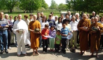 Laity and monastics gather in front of the house for a photo after the pindapat. L to R: Anagarika Laurence, Bhante Khemaratana, Ajahn Viradhammo, Ajahn Kusalo