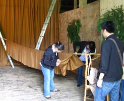 A backdrop was set up in the barn lobby for the new standing Buddha
