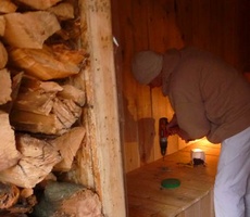 Anagarika Laurence puts some of the finishing touches on the new sauna