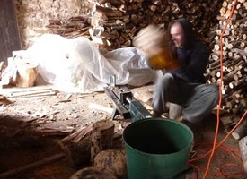 Janko works to split some firewood for the winter