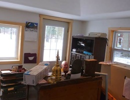 The lay office was used for storage while the trip was being put up in the bhikkhu officezp-1areno