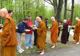 Monastics receive alms on Vesak