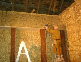 Ajahn Kusalo puts the roof up for the new shrine