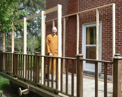 The porch is getting framed in.  A roof will be put on in preparation for Luang Por Sumedho's upcoming visit.