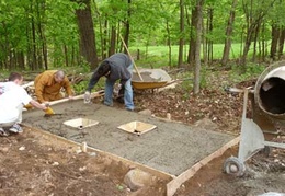 A new concrete slab was poured just outside the barn in order to house the port-o-potties