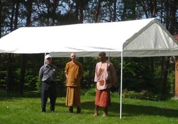 L to R: Crawford, Ven. Sumangalo and Samanera Atulo under the food receiving tent