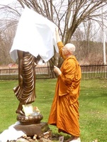 Ajahn Viradhammo unveils the new location of the standing Buddha