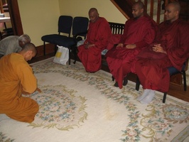Ven. Atulo pays respects to the visiting bhikkhus