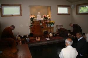 The Sangha leaves to receive alms