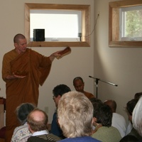 Ajahn Kusalo chants blessings for the assembled laity