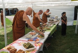 The bhikkhus collect alms at the pah pah