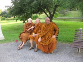The Luang Pors share a bench