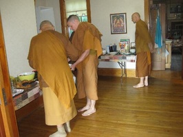 The bhikkhus collect the breakfast