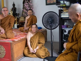 Resident bhikkhus speak with Luang Por Kampong
