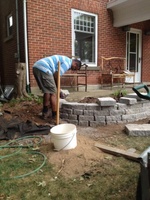 Gamini finishes up the new retaining walls for the garden