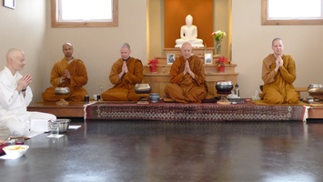 The bhikkhus chant the meal blessing