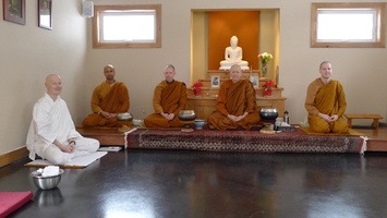 The sangha seated for the meal