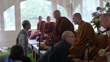 Visitors speak to the senior monks