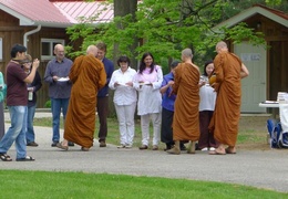 The senior monks collect alms