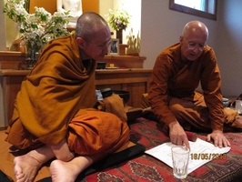 Luang Por Viradhammo shows Tan Ajahn Dtun plans for the upcoming bhikkhu vihara