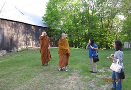 Luang Por Viradhammo takes the group on a tour of the property