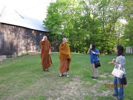 Luang Por Viradhammo takes the group on a tour of the property