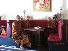 Ajahn Tejapanyo, Tan Ajahn Dtun, and Luang Por Viradhammo at a Thai restaurant near Niagara Falls