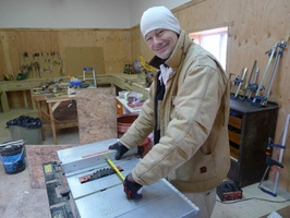 Anagarika John gets to work on some carpentry