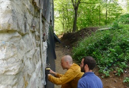 repairing the barn wall