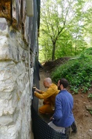 repairing the barn wall