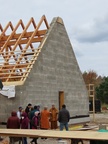 Roofing and showing the Dhamma Hall to visitors